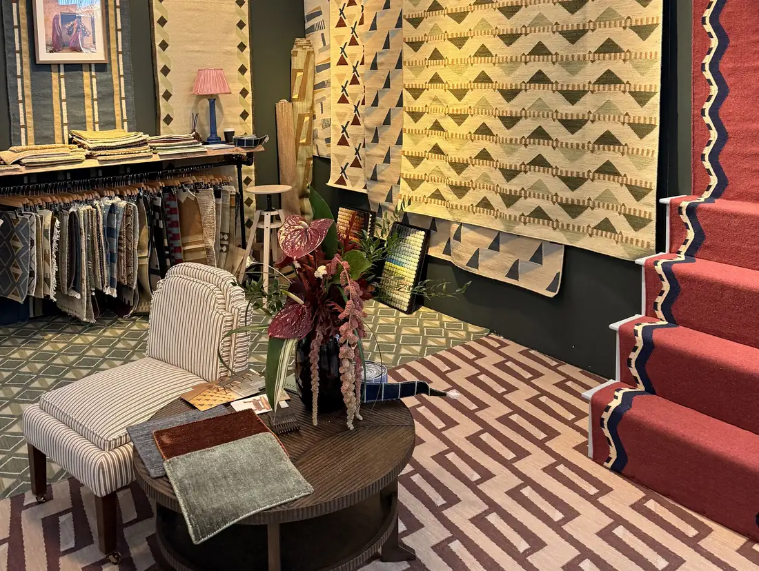 Handwoven geometric rugs and a red zigzag stair runner by Aarohana Home at Decorex 2026, Olympia London