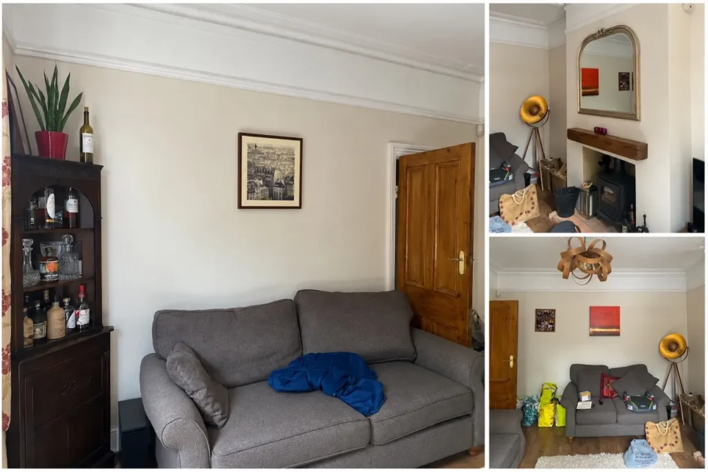 Period living room before the redesign, with cream walls, grey sofas, a wood burner and pine doors